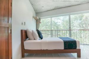 Postel nebo postele na pokoji v ubytování Wabi Sabi Boutique Hotel - SHA Extra Plus