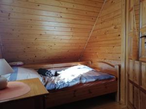Łóżko lub łóżka w pokoju w obiekcie PILGRIM domek gościnny w Gietrzwałdzie na Warmii