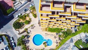 an overhead view of a building with a swimming pool at Picasso-Fincas Benidorm in Benidorm