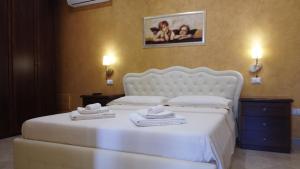 Uma cama ou camas num quarto em Vignali Residence