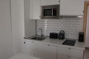 Kuchyň nebo kuchyňský kout v ubytování Apartmány Stříbro