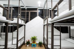 Ein Bett oder Betten in einem Zimmer der Unterkunft 5.T Hostel