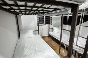 Ein Bett oder Betten in einem Zimmer der Unterkunft 5.T Hostel
