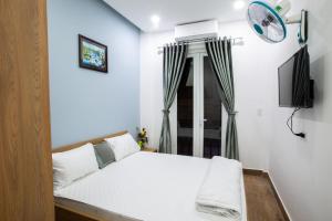 Ein Bett oder Betten in einem Zimmer der Unterkunft 5.T Hostel