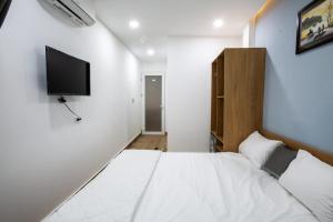 Ein Bett oder Betten in einem Zimmer der Unterkunft 5.T Hostel
