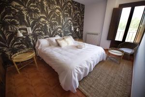 Postel nebo postele na pokoji v ubytování Hotel El Molino