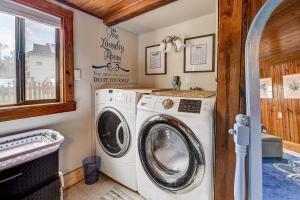 a laundry room with a washer and dryer at Atlantic Shores Getaway steps from Jax Beach Private House Pet Friendly Near to the Mayo Clinic - UNF - TPC Sawgrass - Convention Center - Shopping Malls - Under 3 Hours from DISNEY in Jacksonville Beach