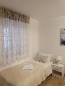 Postel nebo postele na pokoji v ubytování Rooms Marija