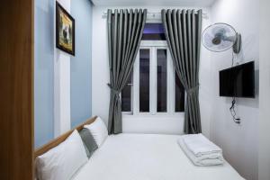 Ein Bett oder Betten in einem Zimmer der Unterkunft 5.T Hostel