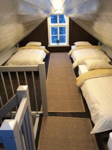 Postelja oz. postelje v sobi nastanitve Den Gule Krambua - Gamle Lærdalsøyri - main street old town