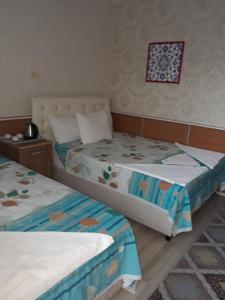 Кровать или кровати в номере Aspawa Hotel