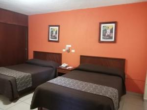 En eller flere senger på et rom på Quinta Mar