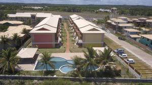 an aerial view of a resort with a swimming pool at Apartamento Summer ville in Itacimirim