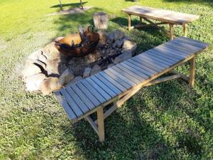 a picnic table and a fire pit with a bowl on it at Indigo Vineyard Farmstay in Beechworth