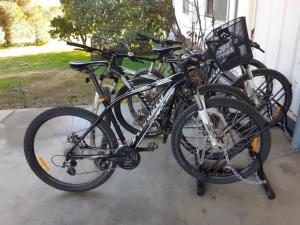 a group of bikes parked next to a house at Indigo Vineyard Farmstay in Beechworth