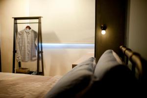 Ένα ή περισσότερα κρεβάτια σε δωμάτιο στο Ken's Joy Inn