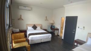 Postel nebo postele na pokoji v ubytování Kenting Heng-Chung Art Hostel