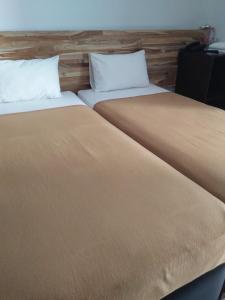 Postel nebo postele na pokoji v ubytování Antika Hotel