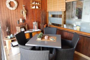 a dining room with a table and chairs at Hotel Brasserie Typisch in Kell