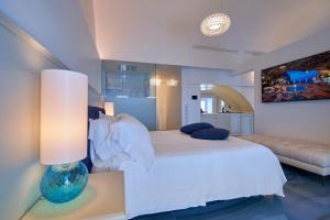 
Ліжко або ліжка в номері Hotel Grotta Palazzese
