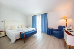 Postel nebo postele na pokoji v ubytování Hotel Bauer & Sporting