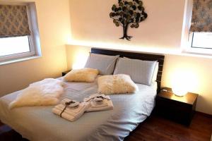 a bedroom with a bed with two bags on it at Appartamento Angelo in Selva di Val Gardena