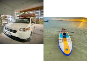 a white car and a kayak parked next to the water at Pranee Amata in Koh Tao