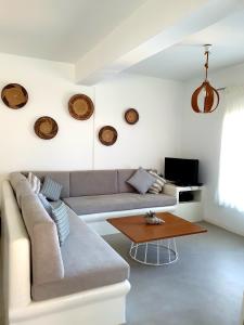 a living room with a couch and a table at Simousea in Kithnos