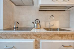 A kitchen or kitchenette at Corte Anibaldi Apartment
