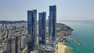 an aerial view of a city with tall buildings at Signiel Busan in Busan