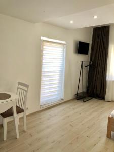 a living room with a table and a window at Summer spot Nida in Nida