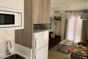 Televizors / izklaižu centrs naktsmītnē céntrico apartamento La Llum 1A