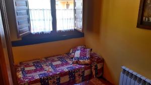 Ein Bett oder Betten in einem Zimmer der Unterkunft Posada La Vieja Escuela