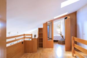 A bed or beds in a room at Flateli Sant Fèlix