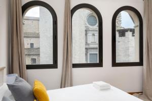 A bed or beds in a room at Flateli Sant Fèlix