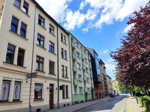 a row of buildings on the side of a street at Apartament Oficyna in Krakow