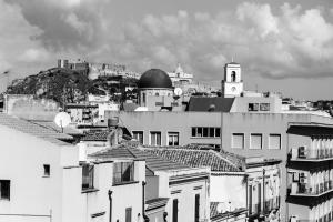 a black and white photo of a city with buildings at Liberty Palace in Milazzo +83 photos