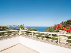 a view of the ocean from a balcony at Holiday Home Emi by Interhome in Massa Lubrense