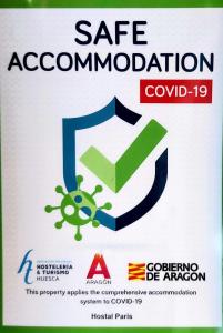 a sign for a safe association with a coronavirus at Hostal Paris in Jaca