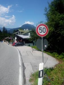a speed limit sign on the side of a road at Rottl-Sepp Renoth Karoline in Berchtesgaden