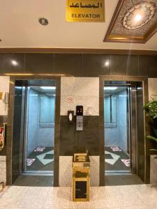 a lobby with two elevators in a building at فندق غالية احد in Al Madinah