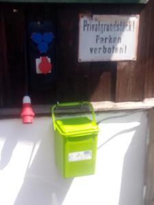 a green bucket sitting on a shelf in a boat at Rottl-Sepp Renoth Karoline in Berchtesgaden