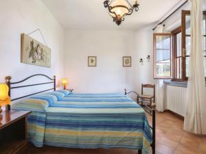A bed or beds in a room at Holiday Home Il Forno - TER101 by Interhome