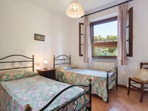 A bed or beds in a room at Holiday Home Il Forno - TER101 by Interhome