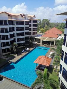 an overhead view of the pool at a resort at Samsuria Beach Apartment Resort in Cherating