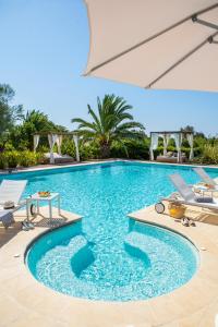 a pool with a pool table and chairs in it at Can Jaume by Ocean Drive in Ibiza Town
