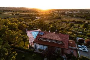 an aerial view of a house with a swimming pool at Villa Dell' Artista - Villa Anna in Santarcangelo di Romagna