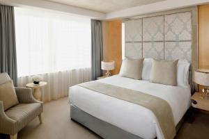 A bed or beds in a room at Crowne Plaza Dubai Festival City