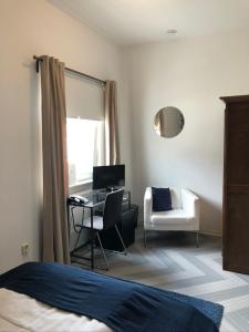 Postel nebo postele na pokoji v ubytování bensons hotel