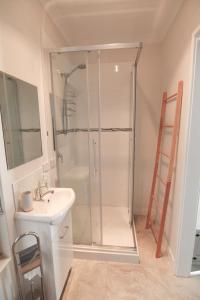 a bathroom with a shower and a sink at Ocean Reef Vista in Perth